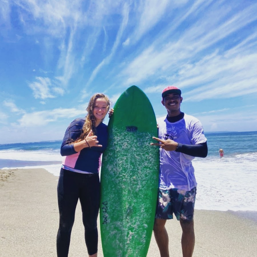 Rocky surf instructor coaching student at Batu Bolong